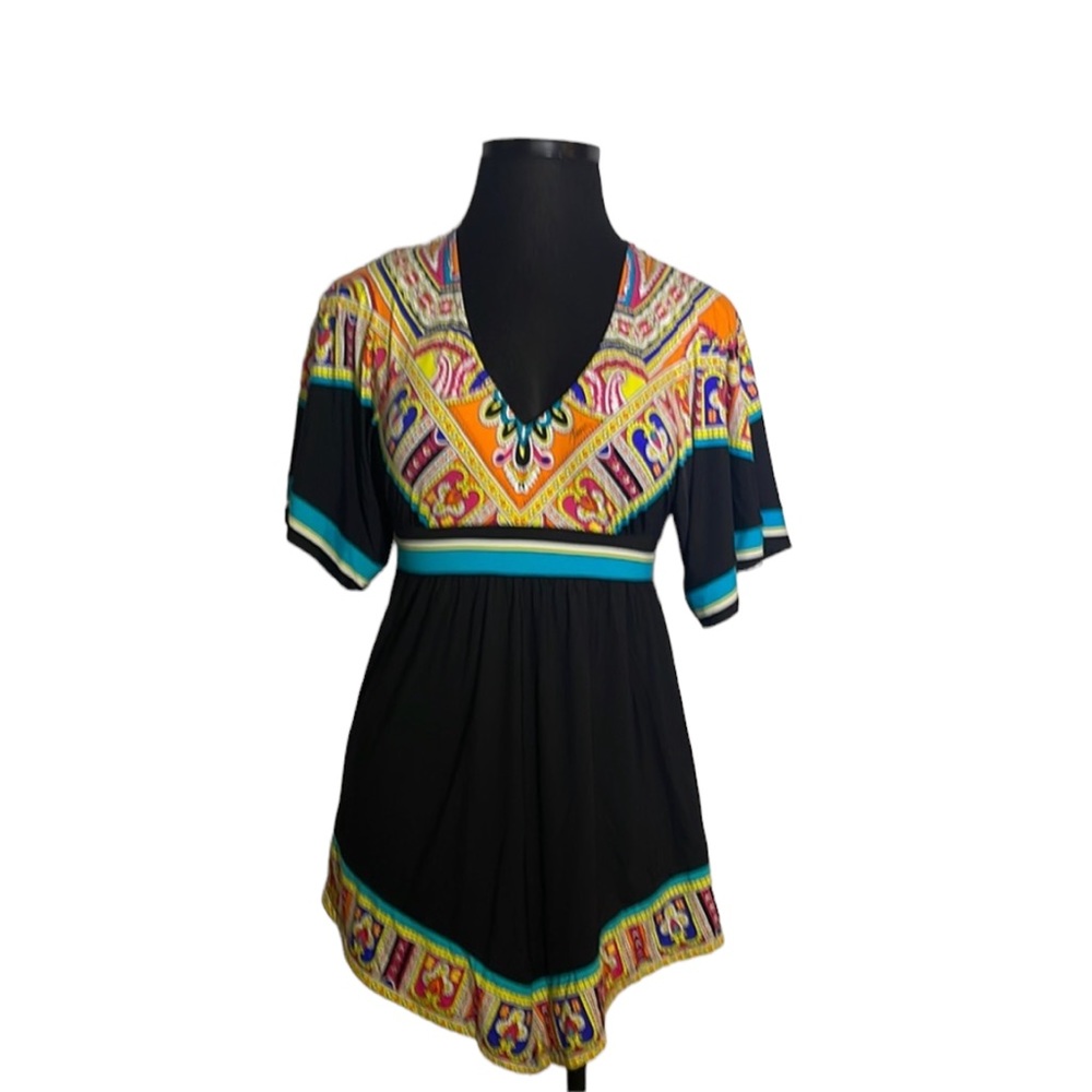 Trina Turk top with vibrant colors. V-neck. Beautiful detail on bottom.  Size M